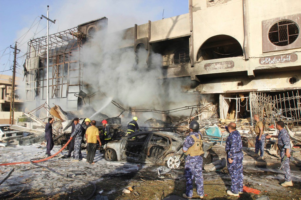 Al menos 21 personas murieron y 118 resultaron heridas al estallar de forma casi simultánea tres coches bombas en la norteña ciudad iraquí de Kirkuk. Foto Reuters