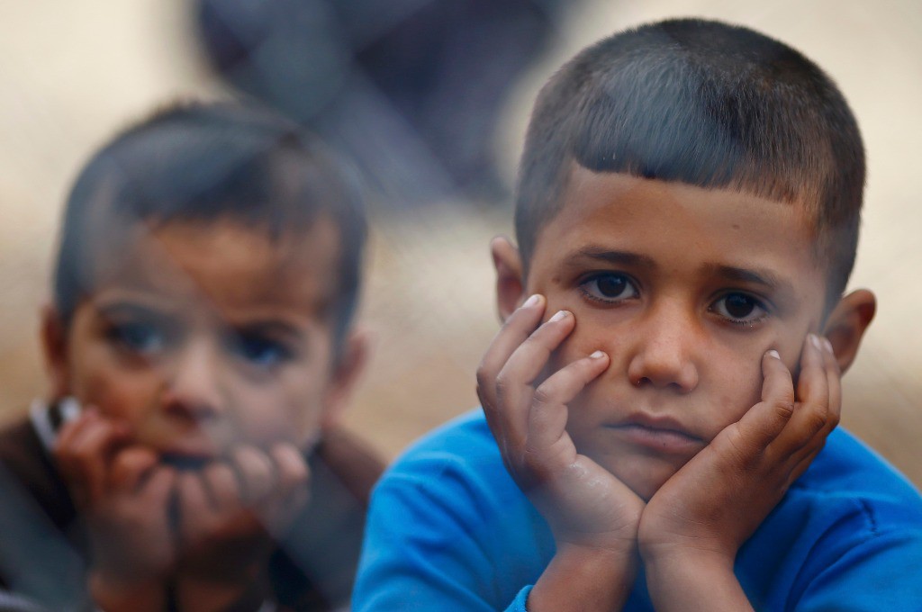 Niños kurdos en un campo de refugiados en la ciudad de Suruc. Foto Reuters